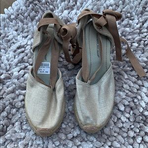 Gold espadrille sandals with an ankle tie